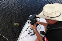 [stock image of DS Williamson using underwater drone during training]